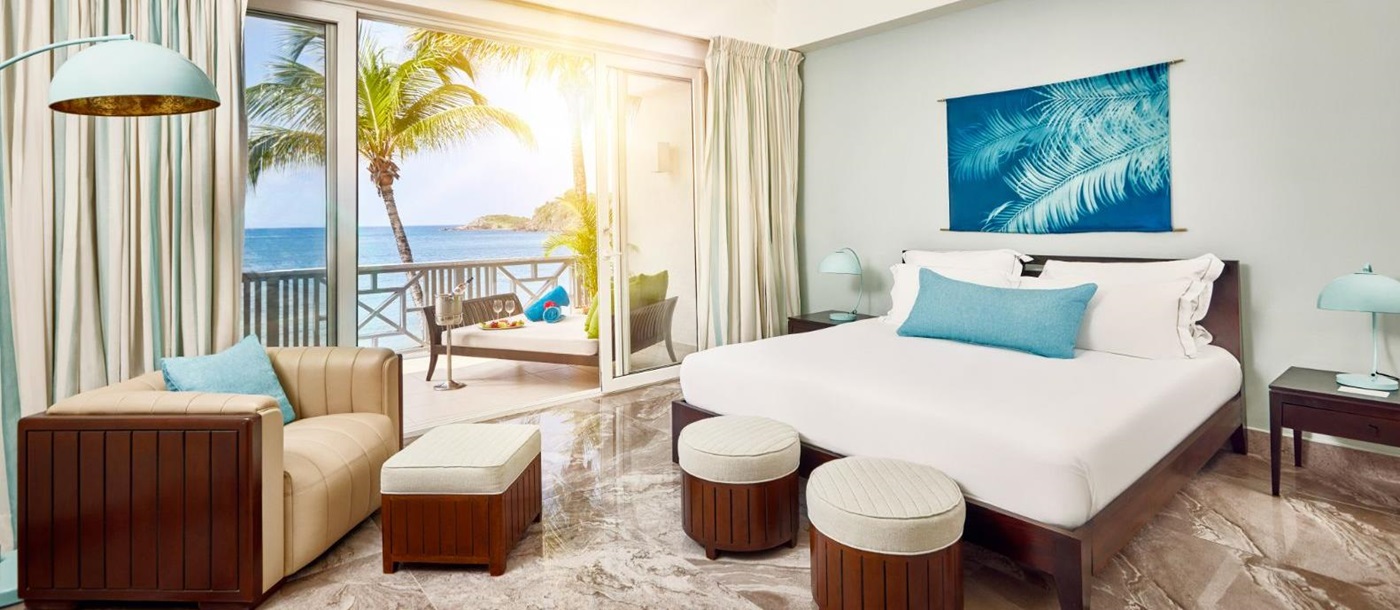 Beach Balcony Suite bedroom at Carlisle Bay in Antigua