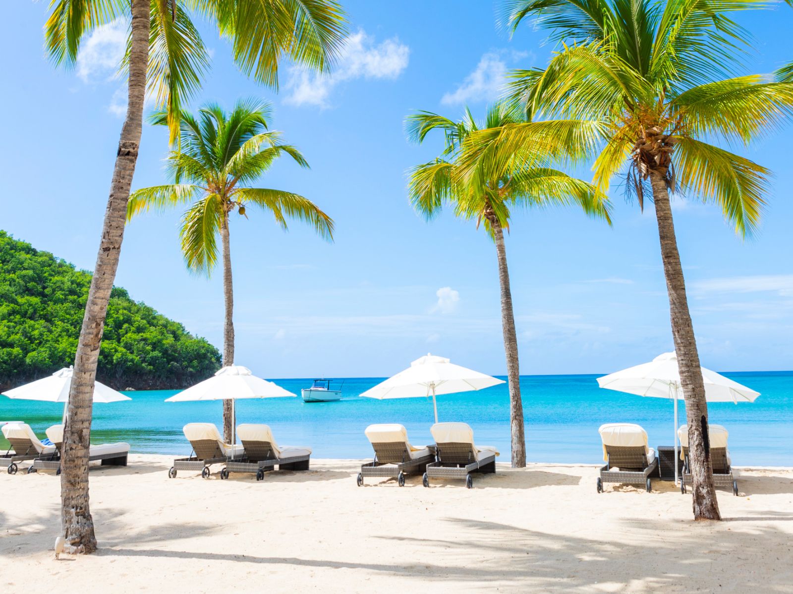 Sun loungers on the beach of Carlisle Bay resort in Antigua