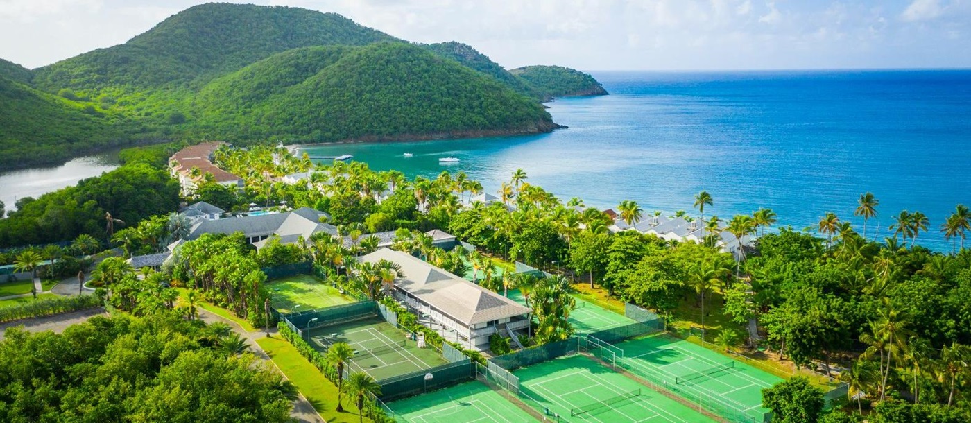 Tennis courts and view of Carlisle Bay resort in Antigua