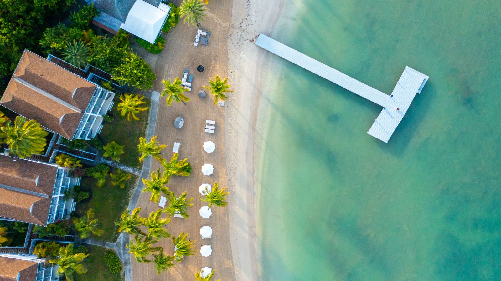 Aerial view of the beach and pier at Carlisle Bay resort in Antigua