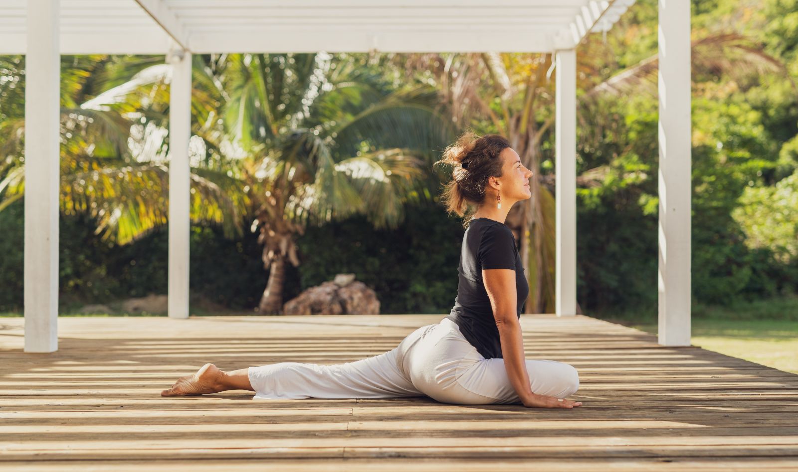 A woman practising yoga  in the pavilion at Carlisle Bay resort in Antigua