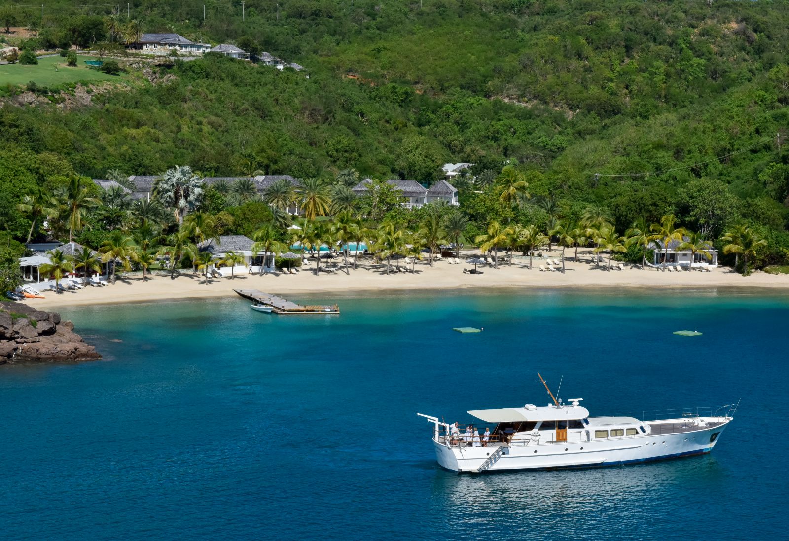 The beach and private boat for guests at the Inn at English Harbour Antigua