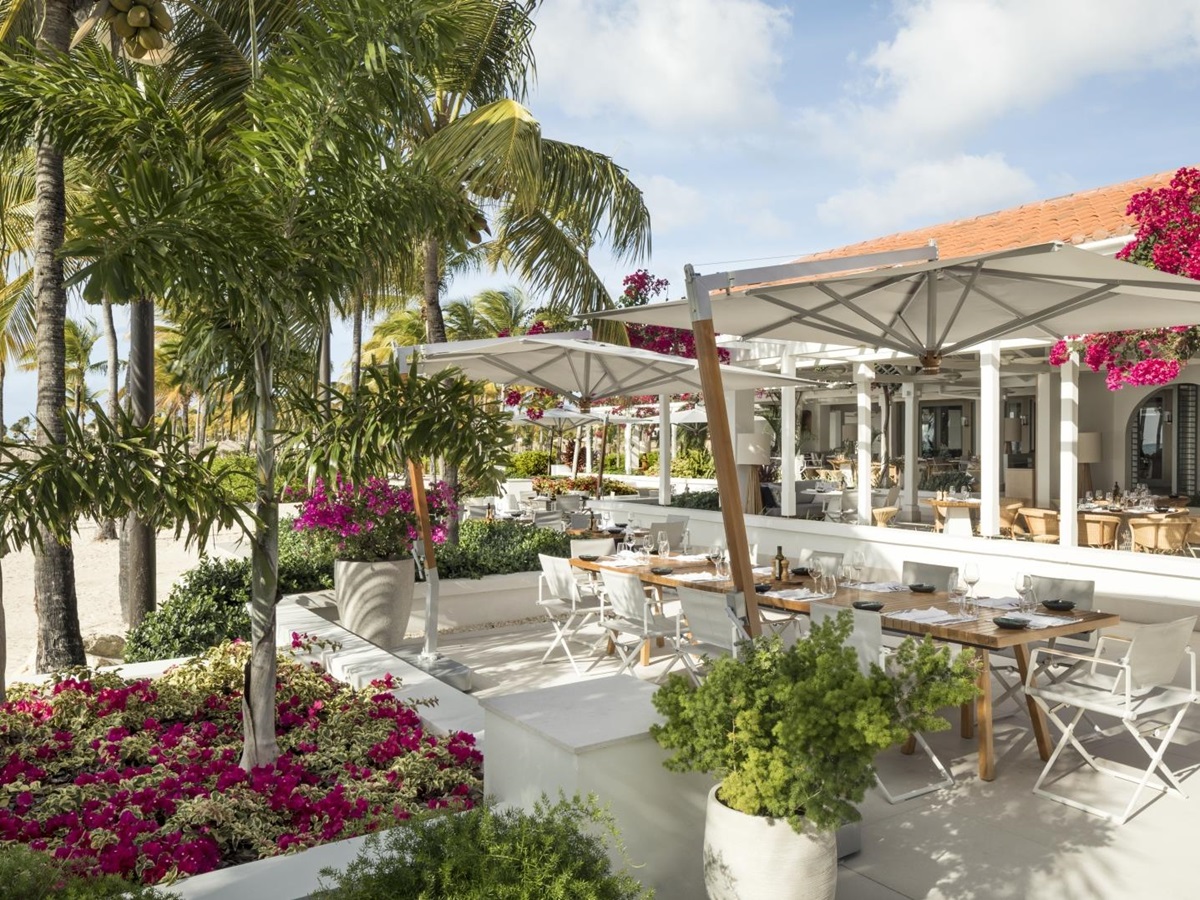 Outdoor dining by the beach at Jumby Bay
