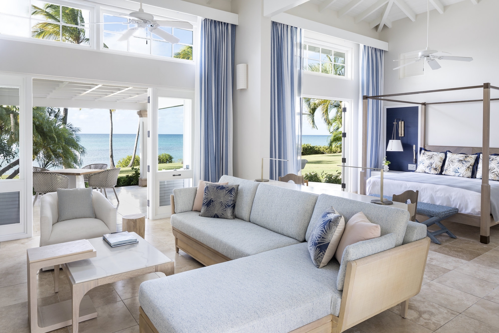 A room with bed, lounge and private terrace
