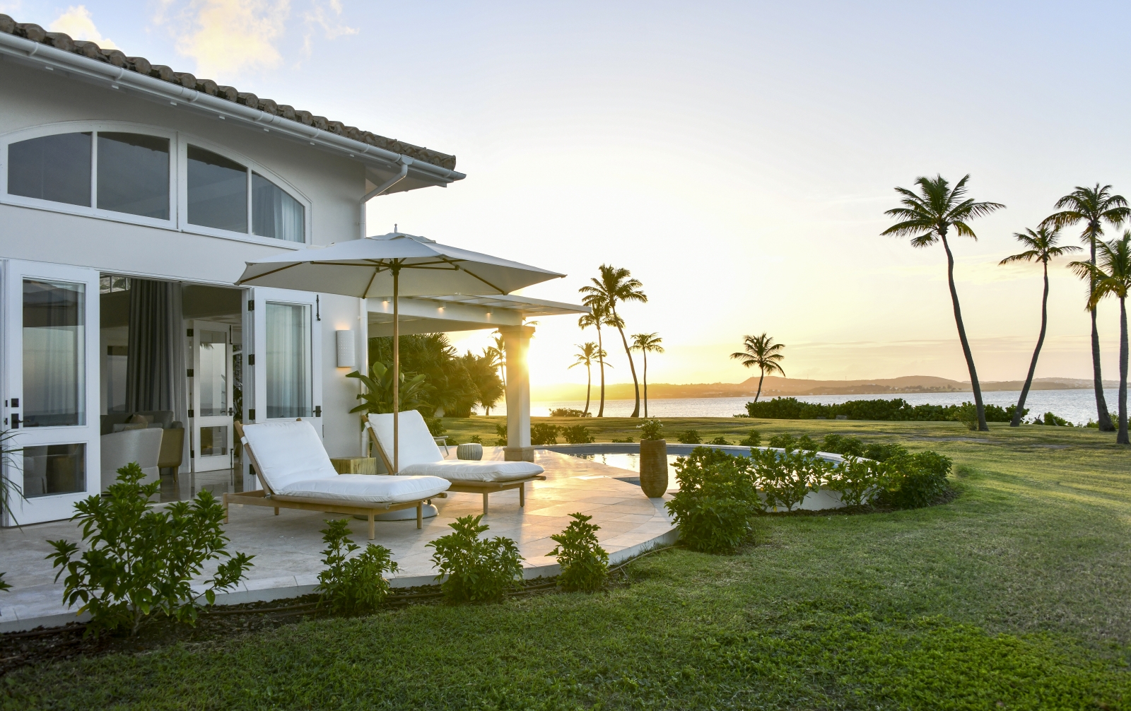 Sunset over a villa with private pool and terrace