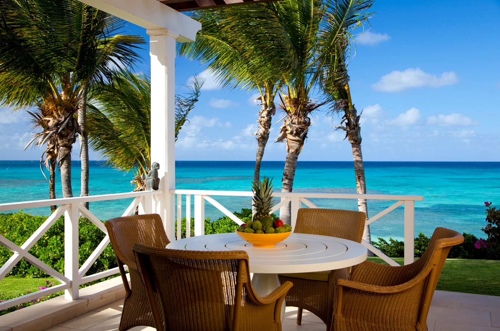 Outdoor terrace with sea view at Frangipani, Antigua