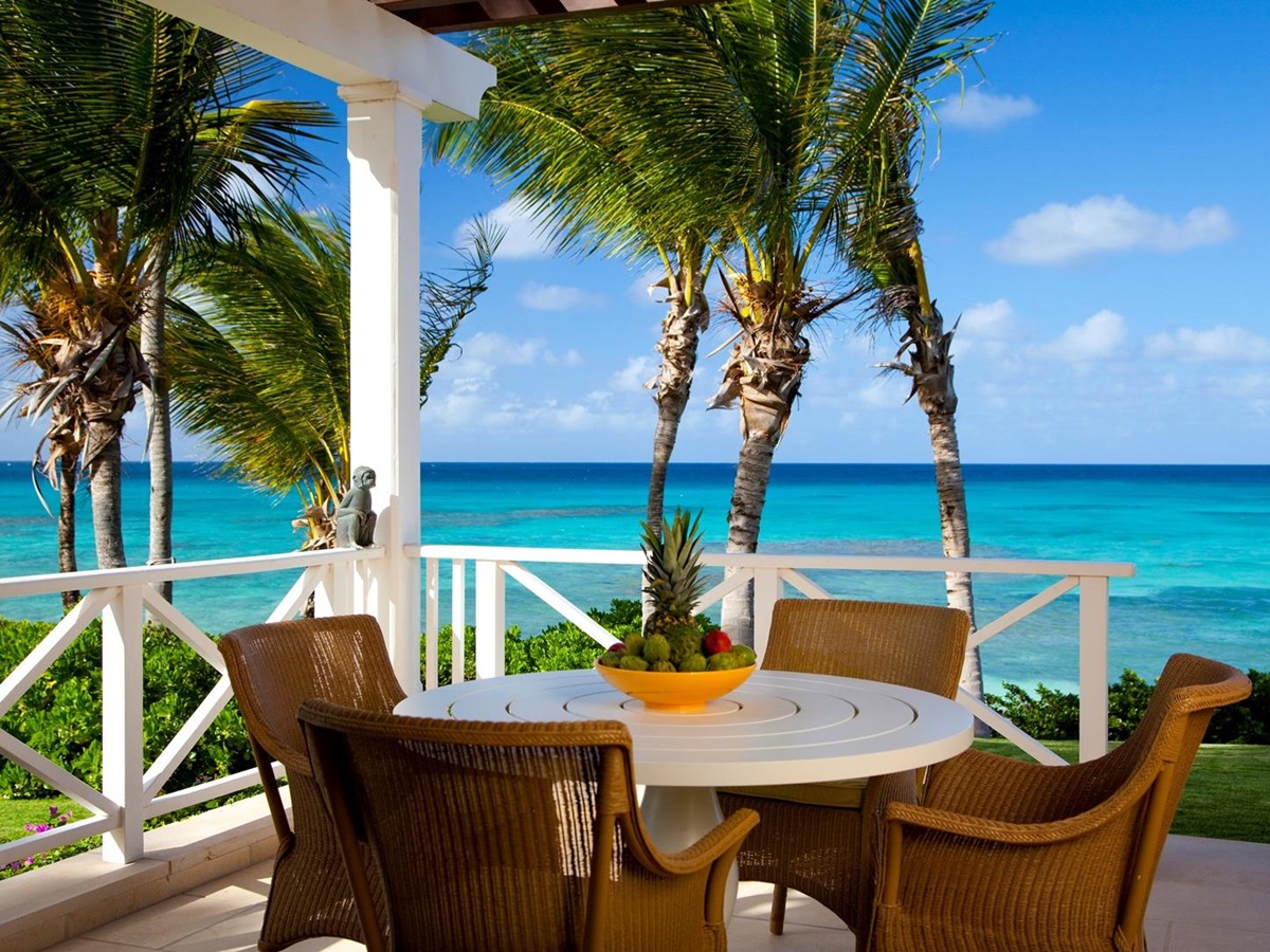 Outdoor terrace with sea view at Frangipani, Antigua