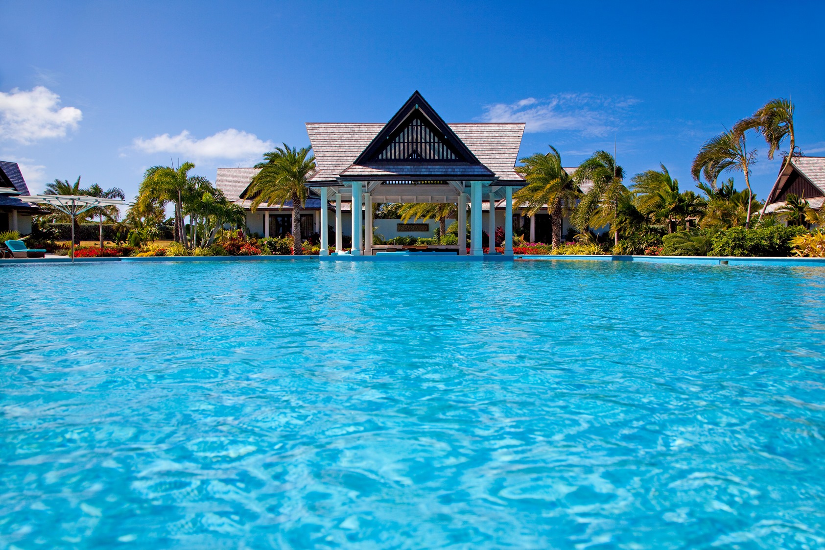 the swimming pool and pool house of lazy lizard, antigua