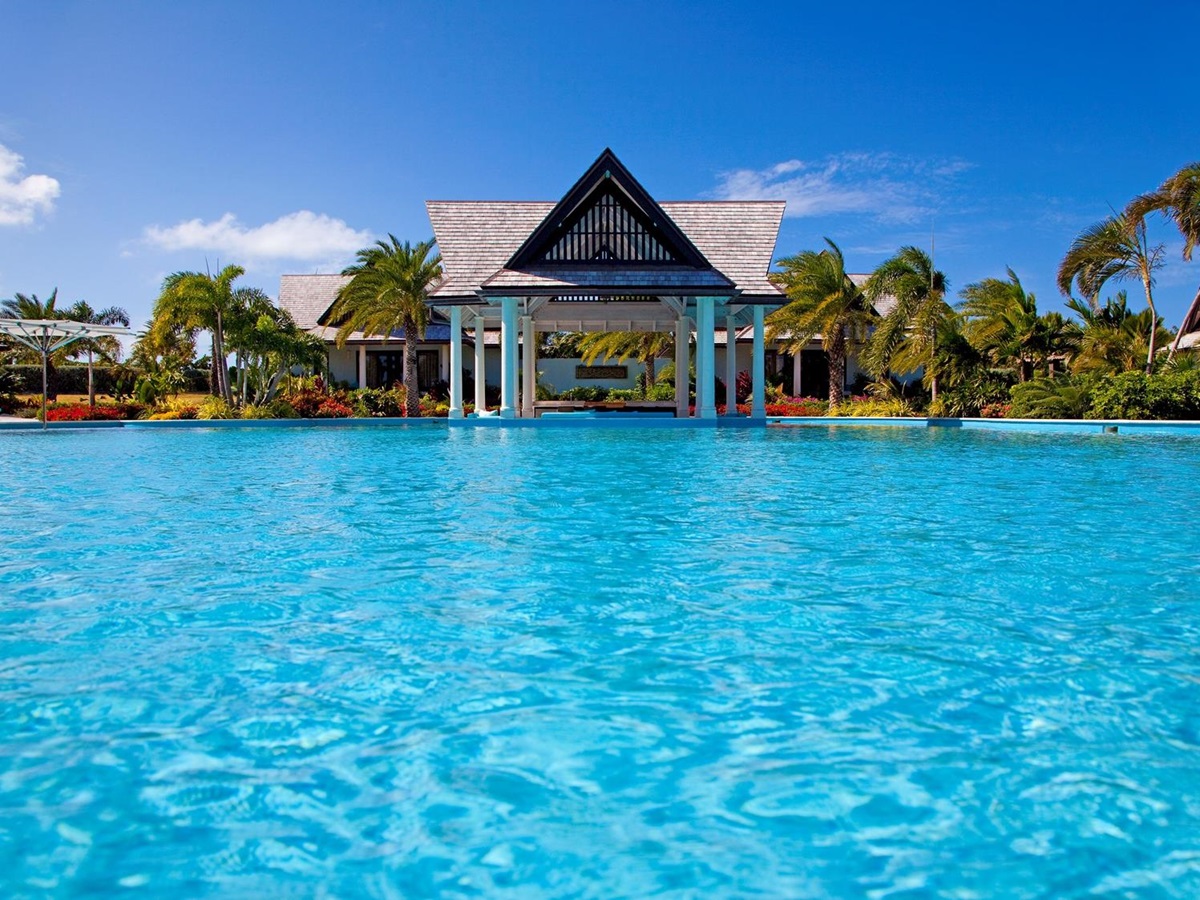 the swimming pool and pool house of lazy lizard, antigua