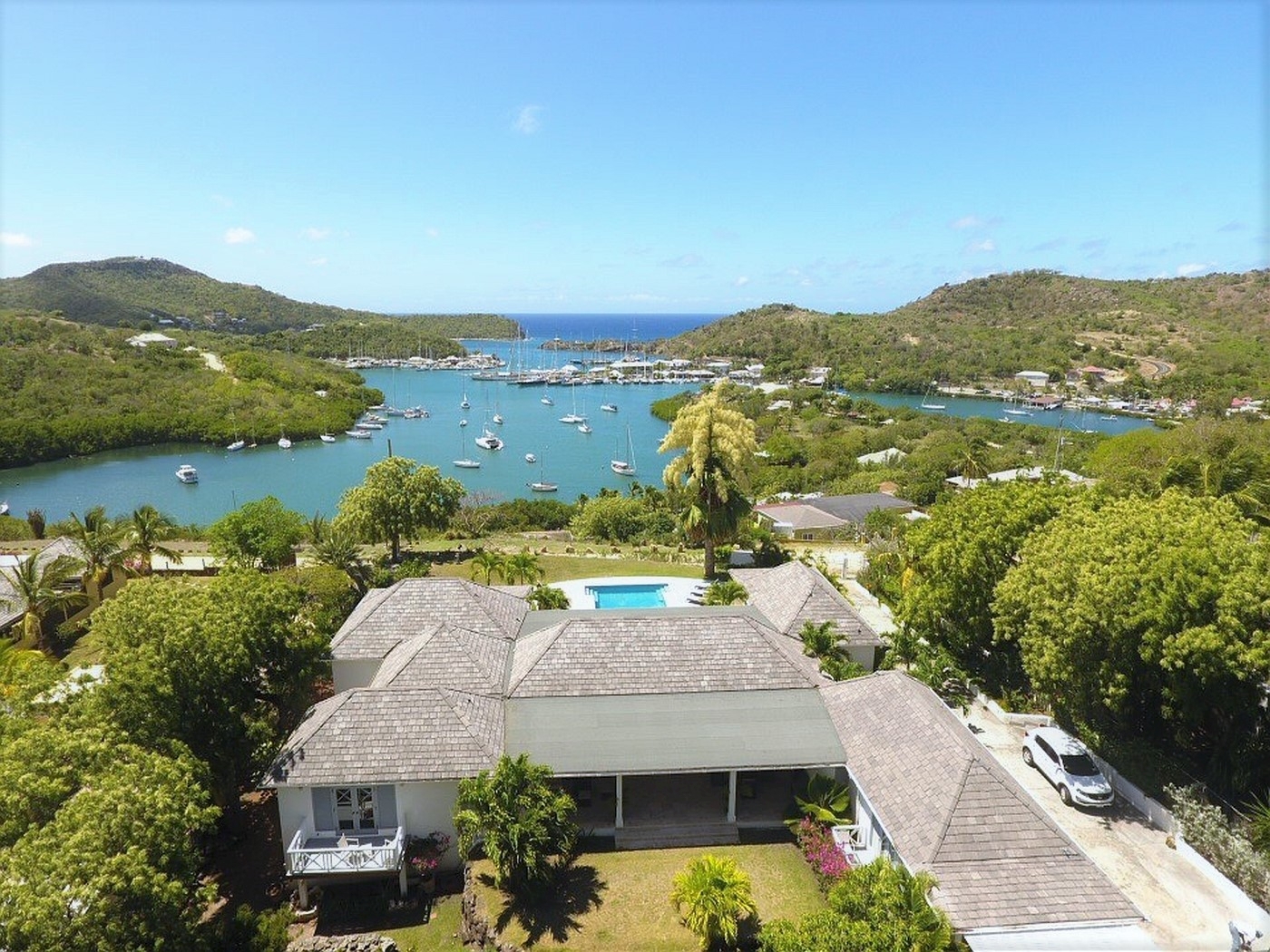 Aerial over the roof of The Hill Club with views of English Harbour