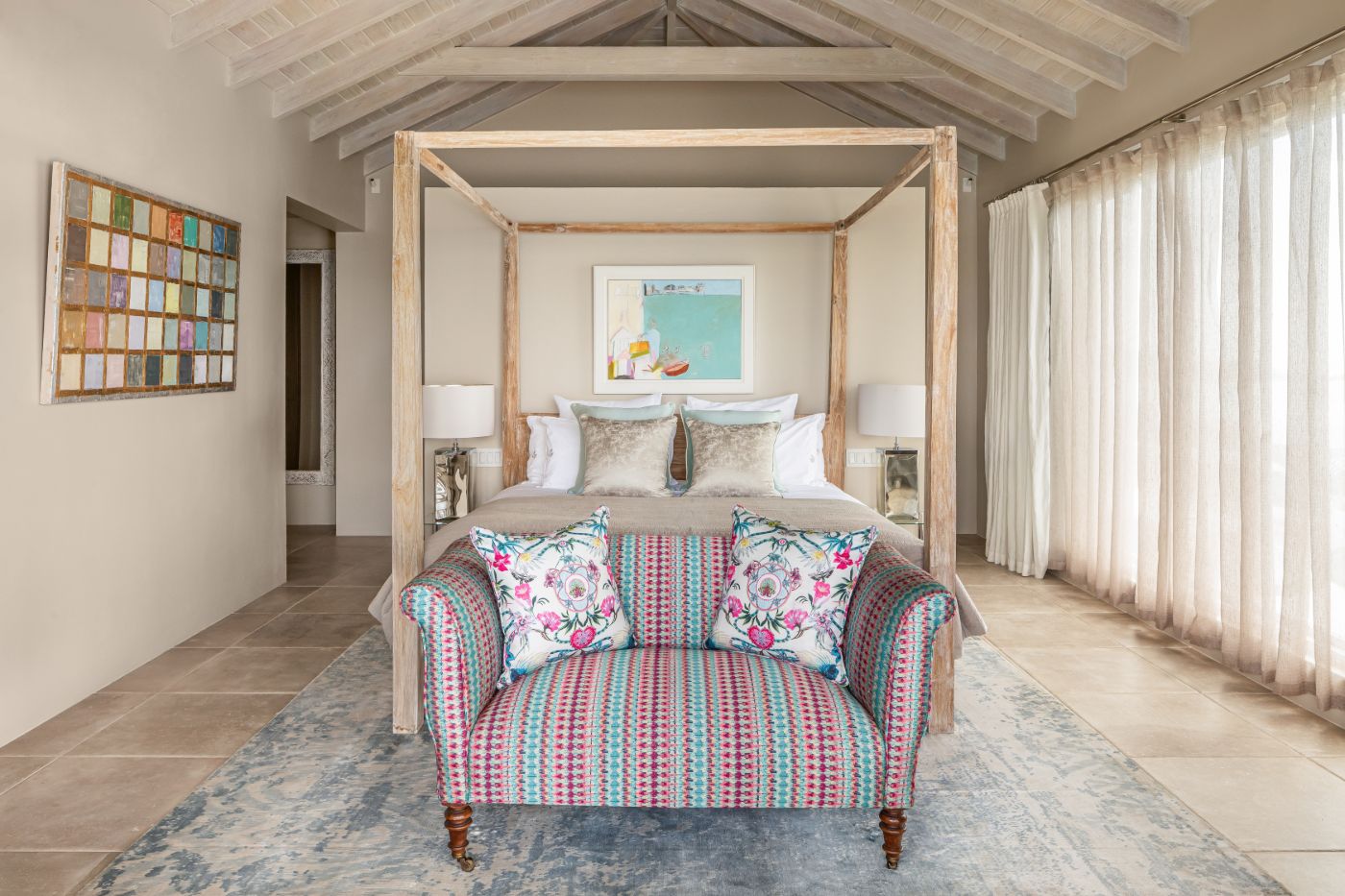 Bedroom with four poster bed at Villa Papillon