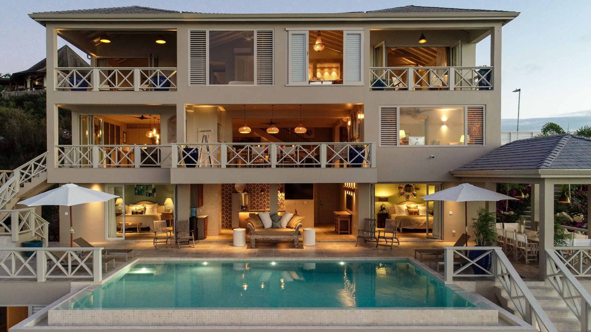 Exterior view of the front aspect and pool at Villa Papillon