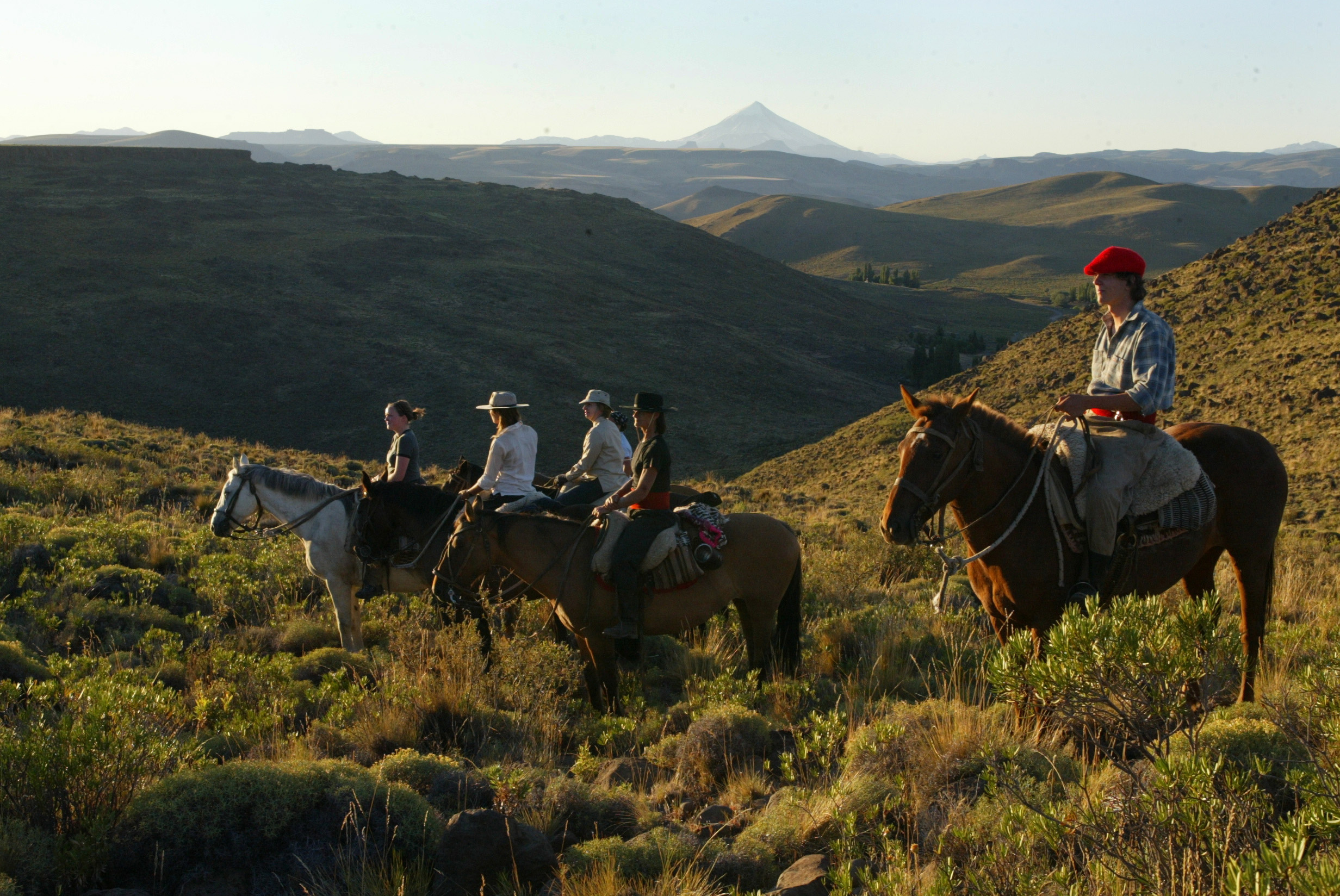 Four horse riders at Huechahue, Argentina