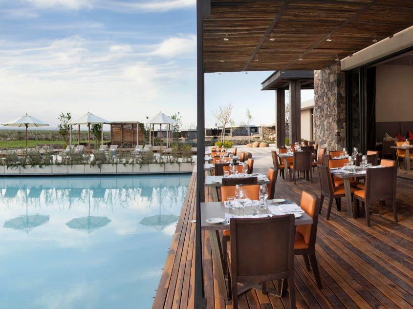 Poolside restaurant seating at The Vines Resort & Spa in Argentina's Uco Valley