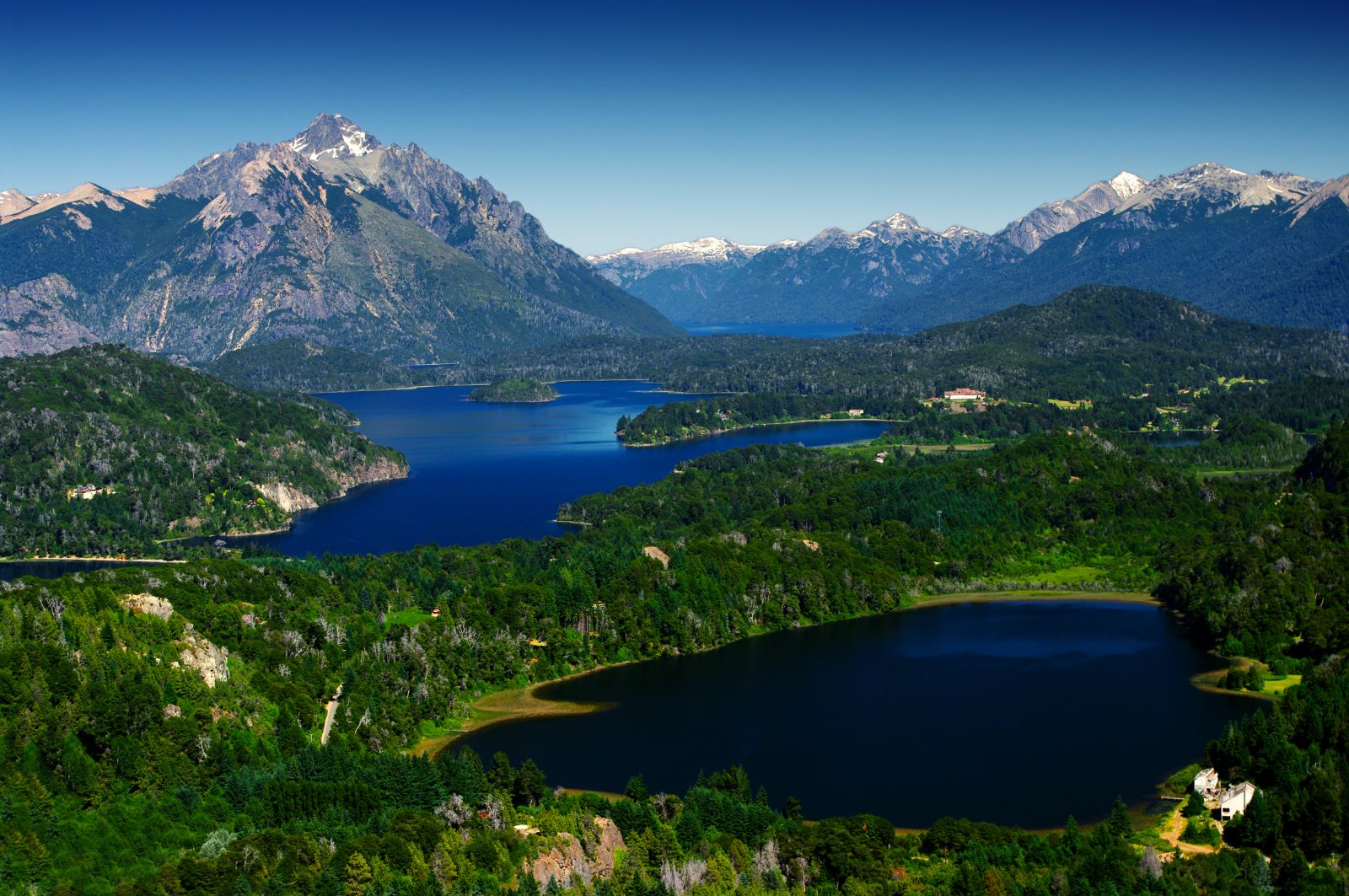 Aerial view of deep blue sea and abundant greenery in Bariloche, Argentina