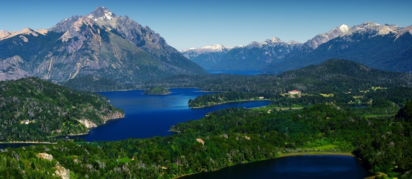Aerial view of deep blue sea and abundant greenery in Bariloche, Argentina