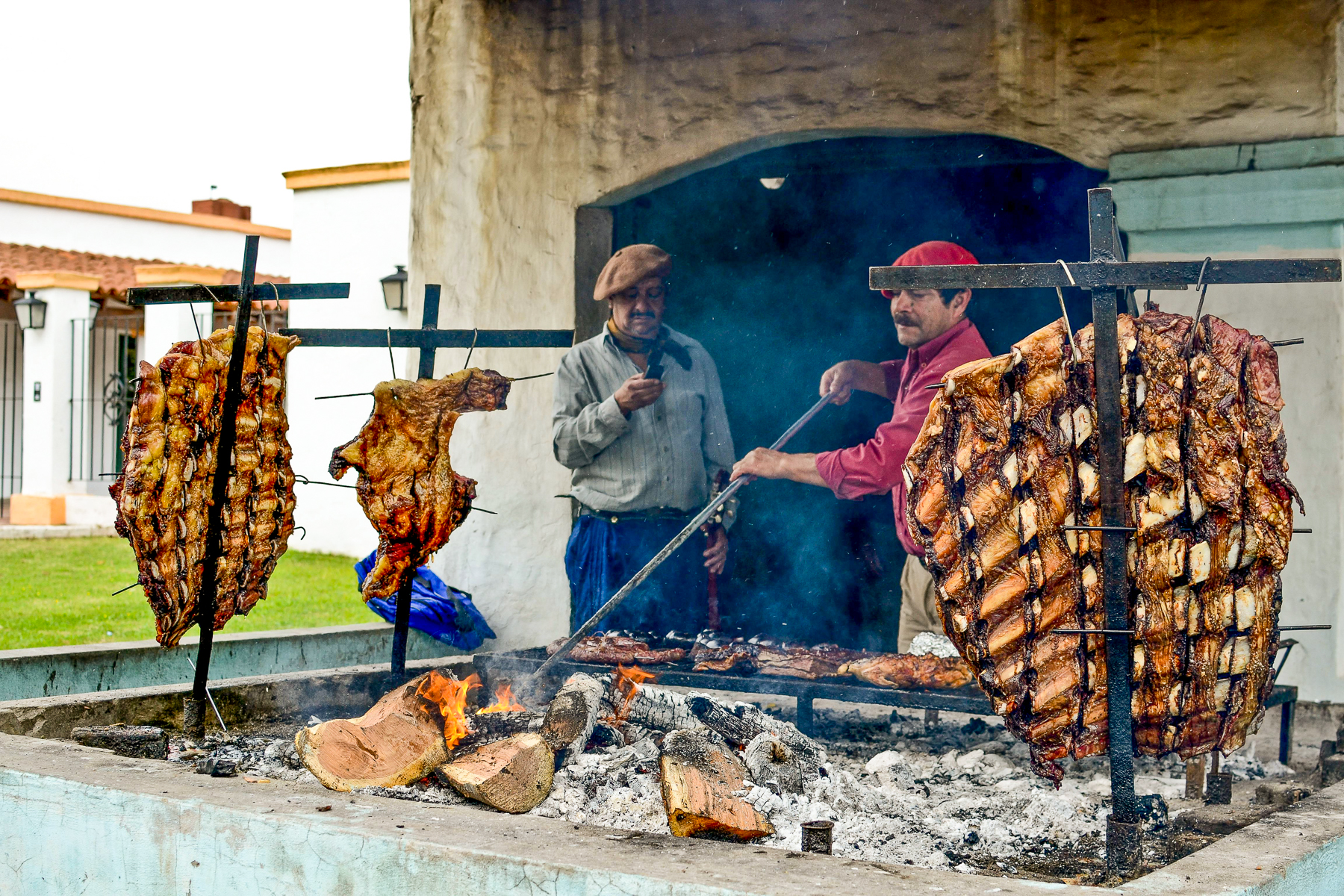 Gachos tending to an asado in Argentina