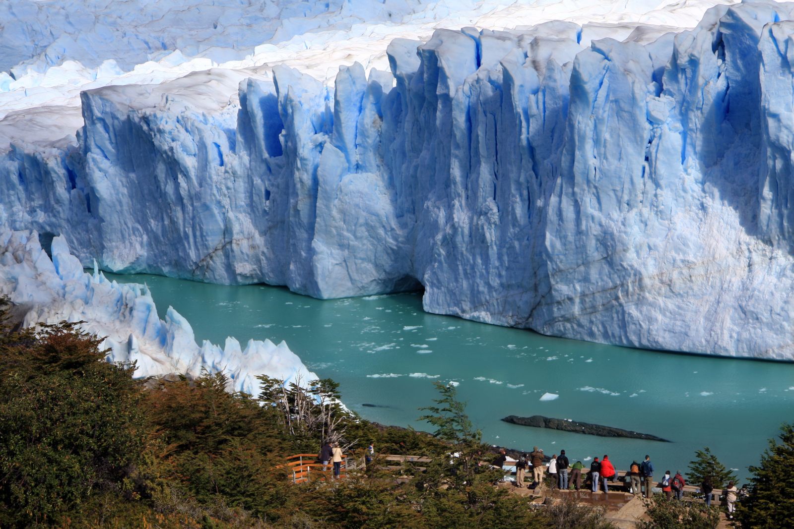Visitors observing the face of the Perito Moreno glacier in Argentinian Patagonia