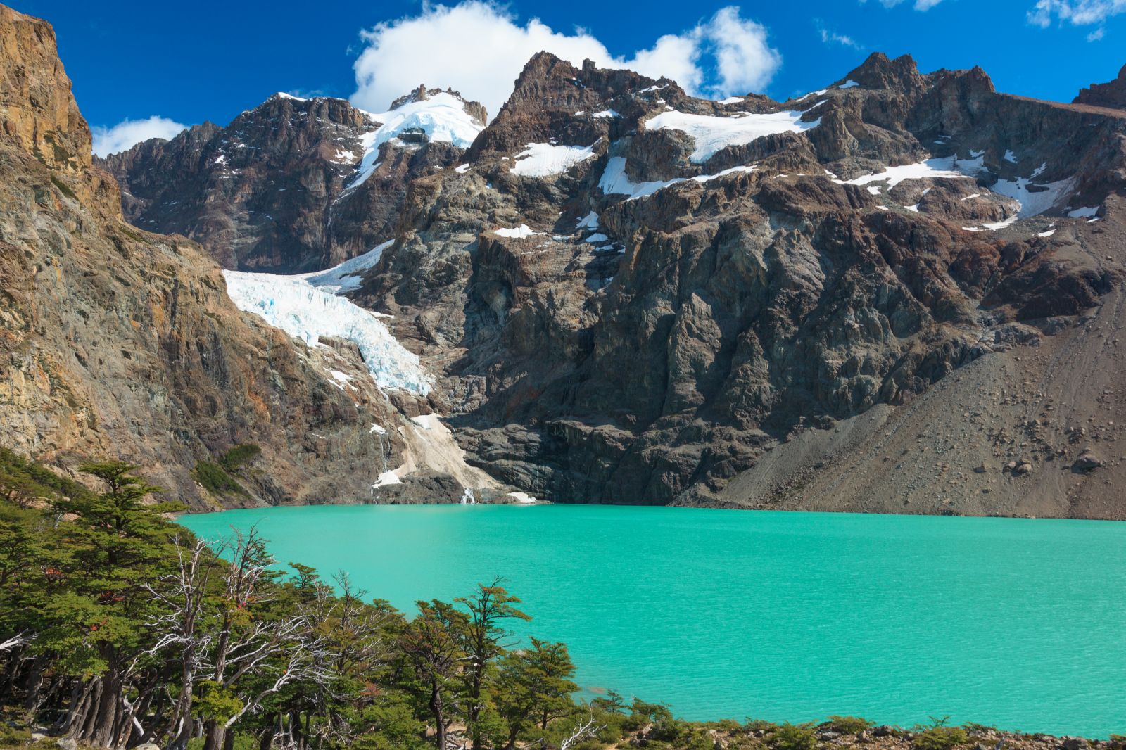Santa Cruz snow-capped mountain range with bright blue water, Patagonia, Argentina