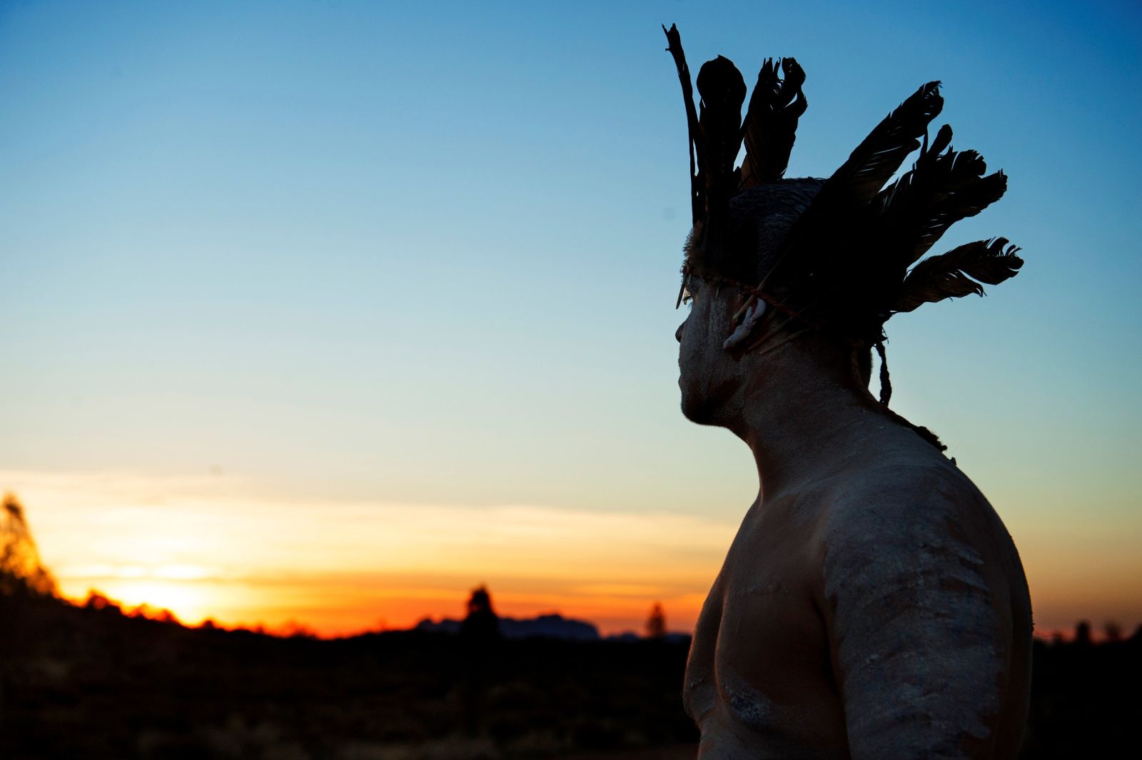Silhouette image of Aboriginal man at sunset