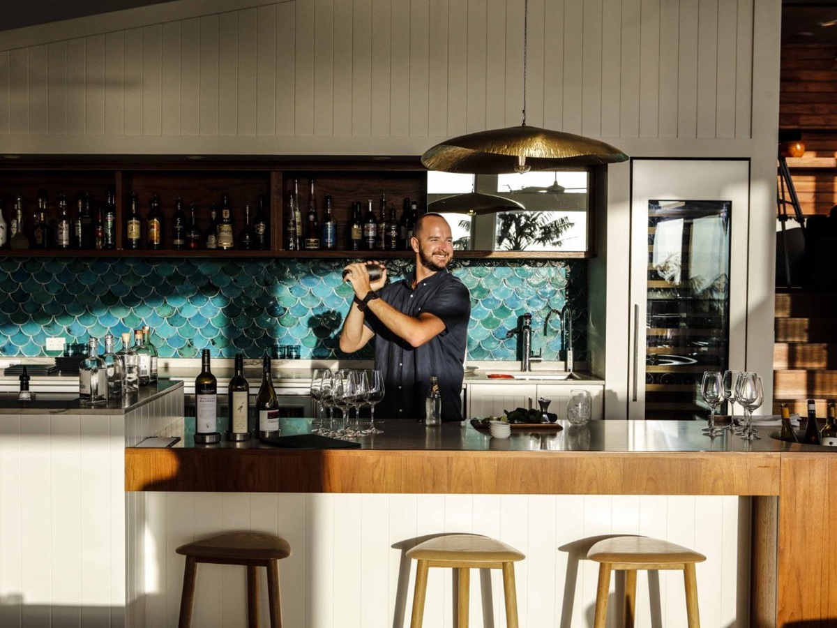sunny indoor bar with bartender making a cocktail in luxury Capella Lodge in Australia