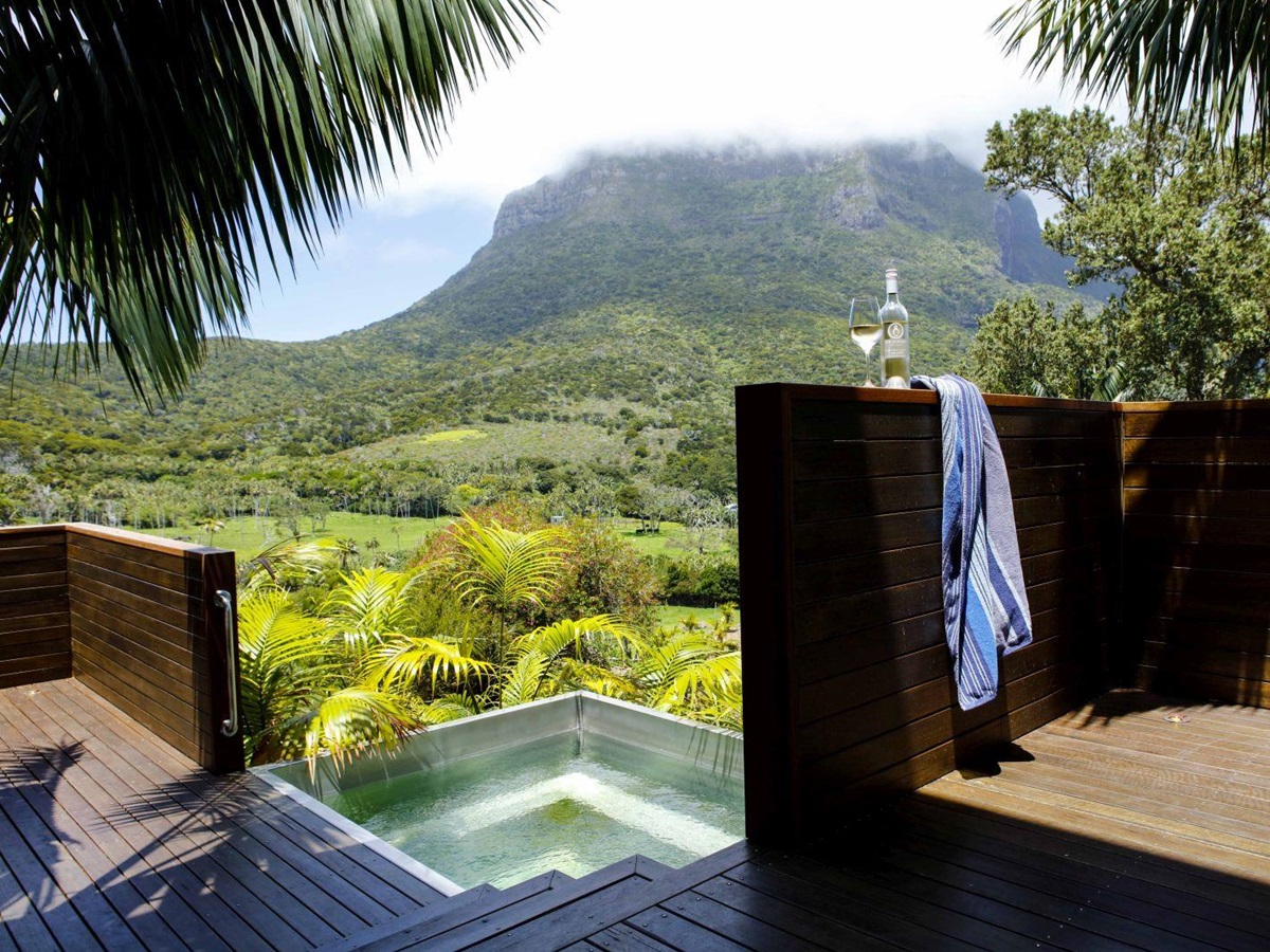 View of a pool and the surrounding landscape at Capella Lodge in Australia