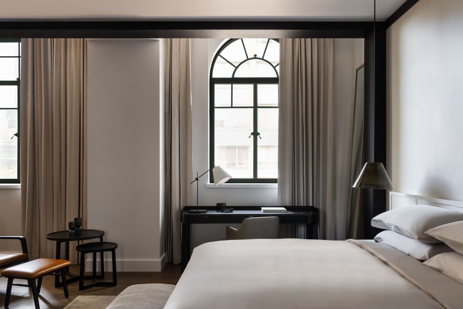 Guest suite bedroom at the Capella Sydney hotel in Australia