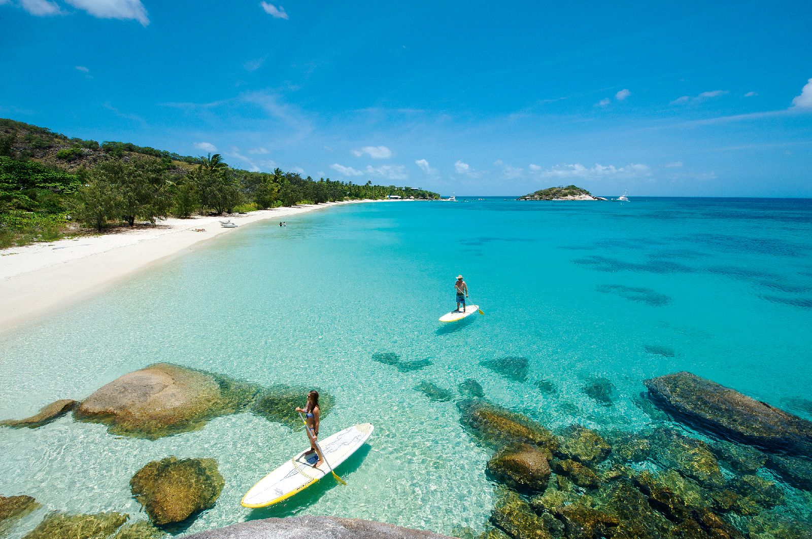 Paddle boarding around beautiful coastline at Lizard Island on Australia's Great Barrier Reef