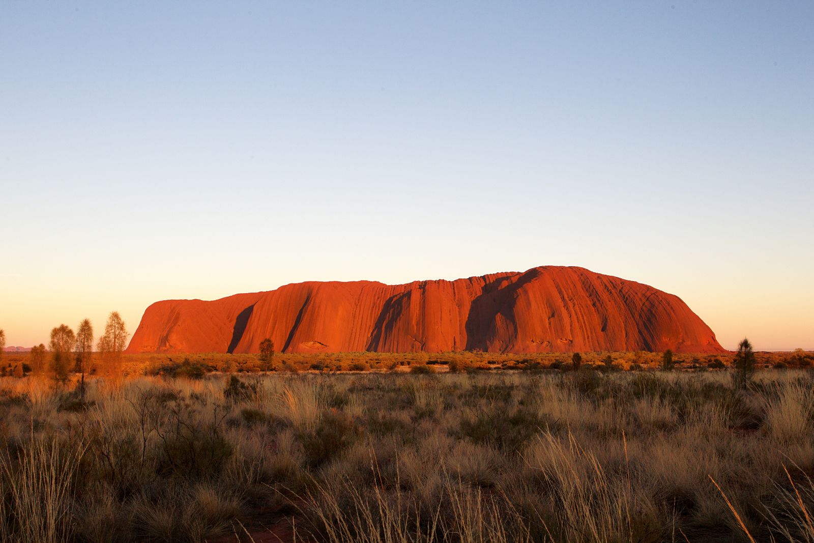 View of Ayers Rock at sunset from Longitude 131 luxury camp in Australia