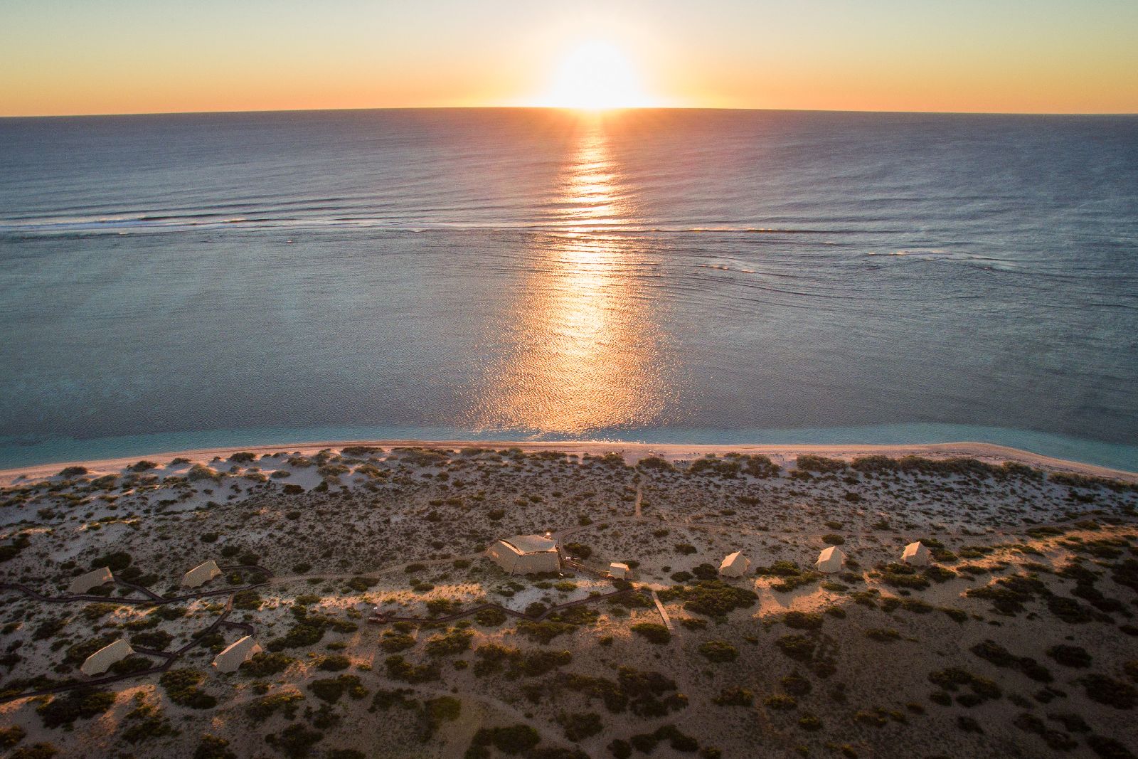 Aerial view of the tents and ocean at Sal Salis luxury camp in Western Australia