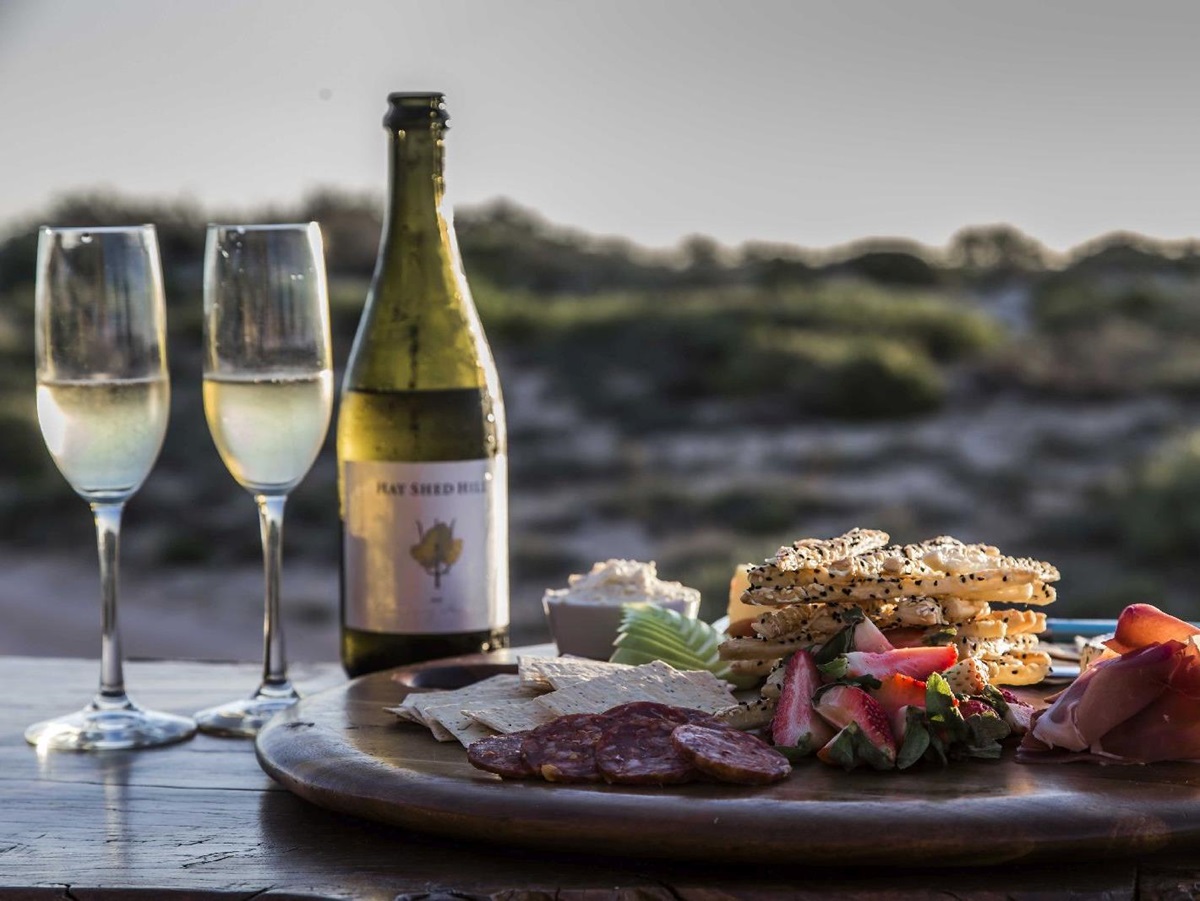 Evening wine and canapes at Sal Salis luxury camp in Western Australia