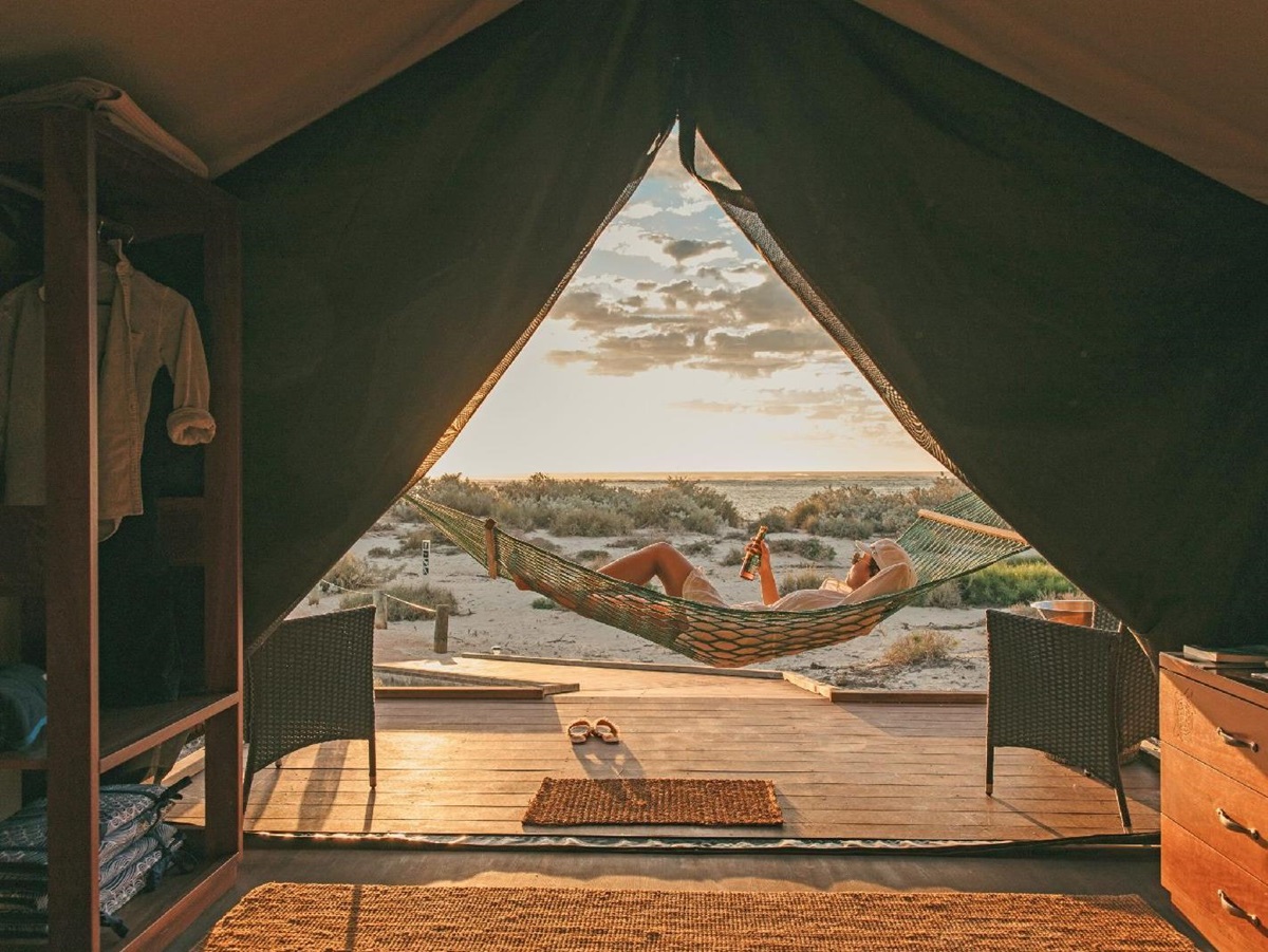 Guest enjoying their hammock at Sal Salis luxury camp in Western Australia