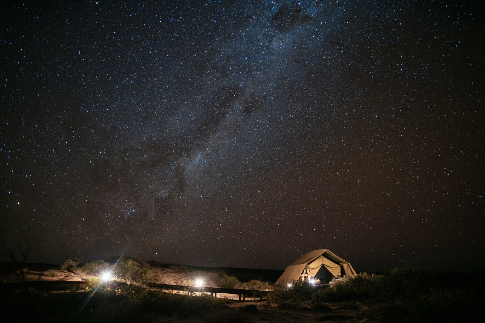 A tent at Sal Salis luxury camp in Western Australia under a starry night sky