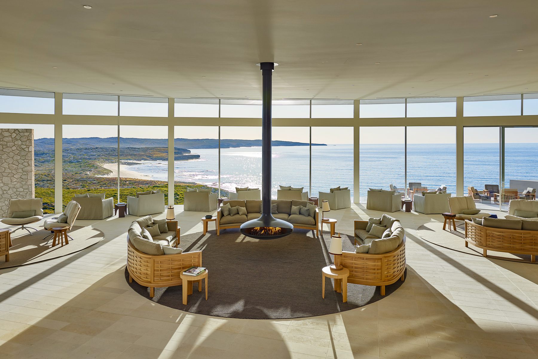 Great room with fireplace and ocean views at Southern Ocean Lodge 