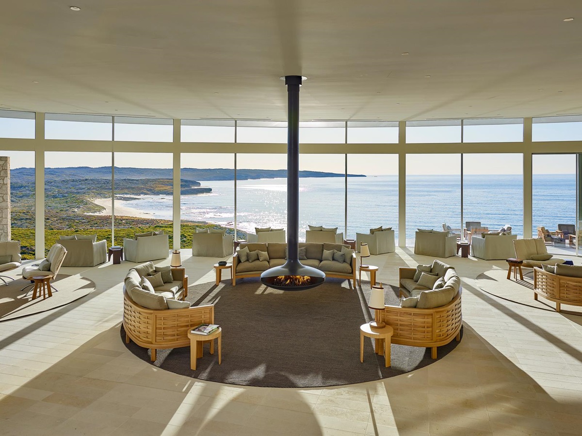 Great room with fireplace and ocean views at Southern Ocean Lodge