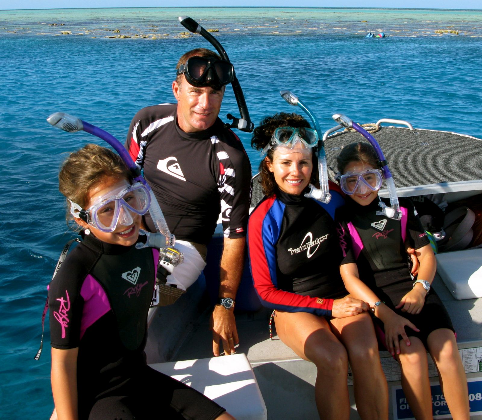 A family snorkelling on True North