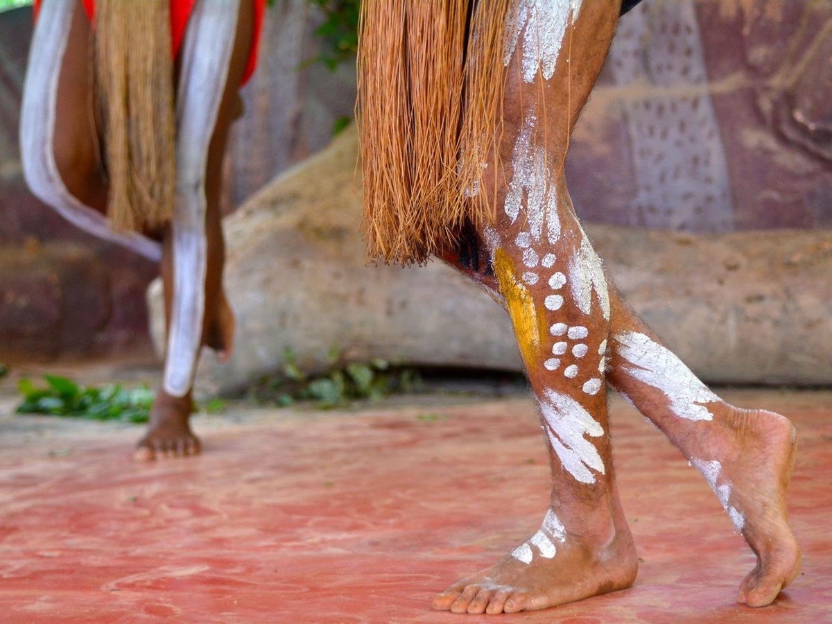 Aboriginal Australians dancing in traditional costume