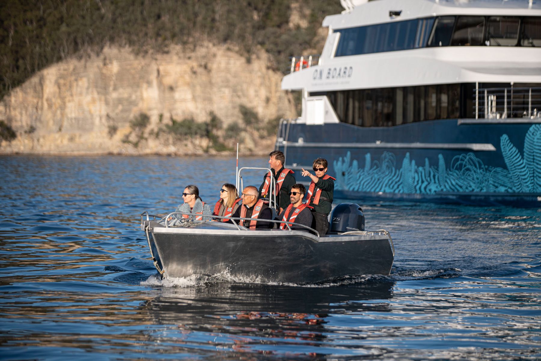 Guests of an Odalisque III cruise in Tasmania on a tender