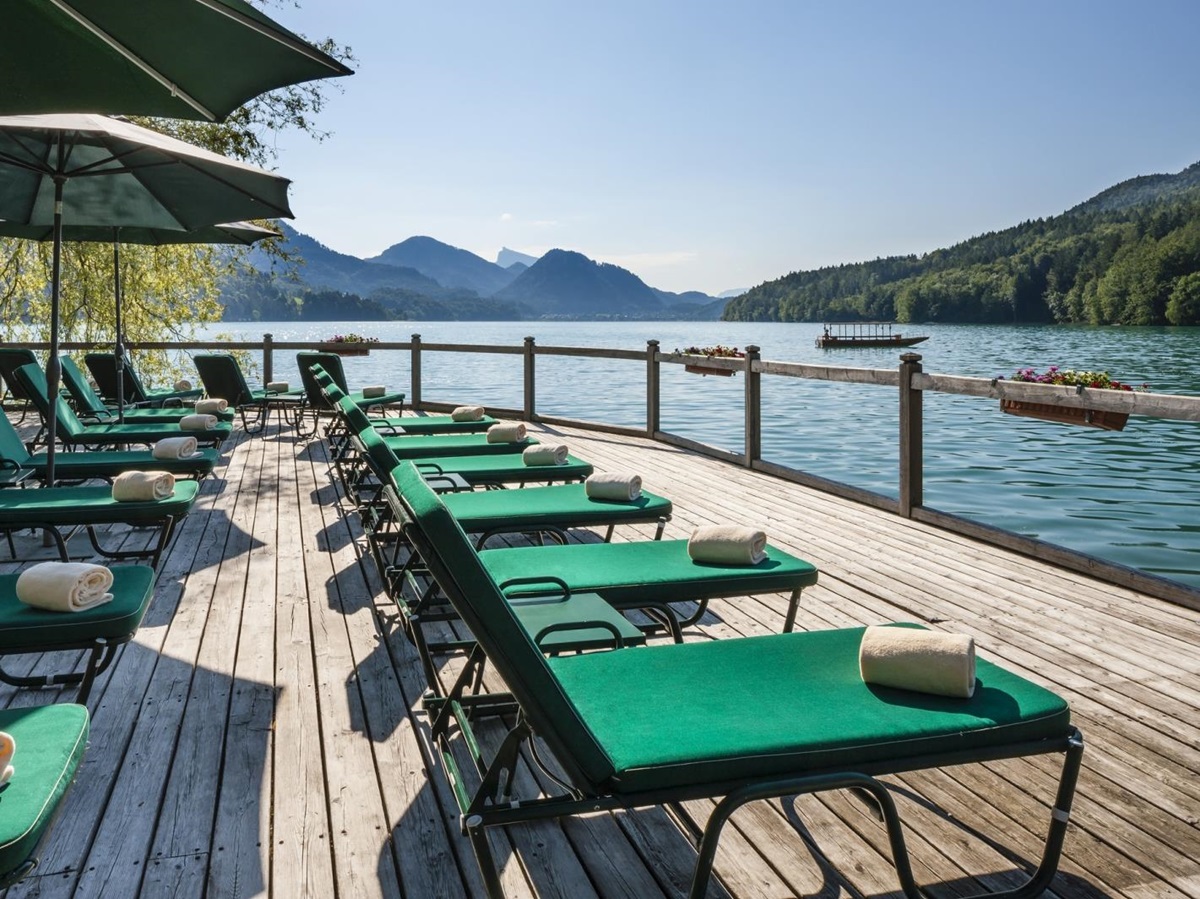 Sun deck with loungers and parasols at luxury hotel Schluss Fuschl in Austria