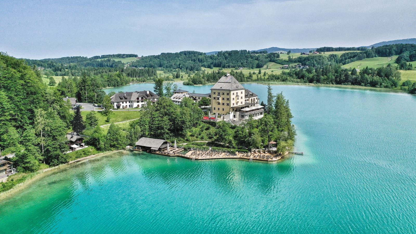 Aerial view of luxury hotel Schluss Fuschl in Austria and the lake