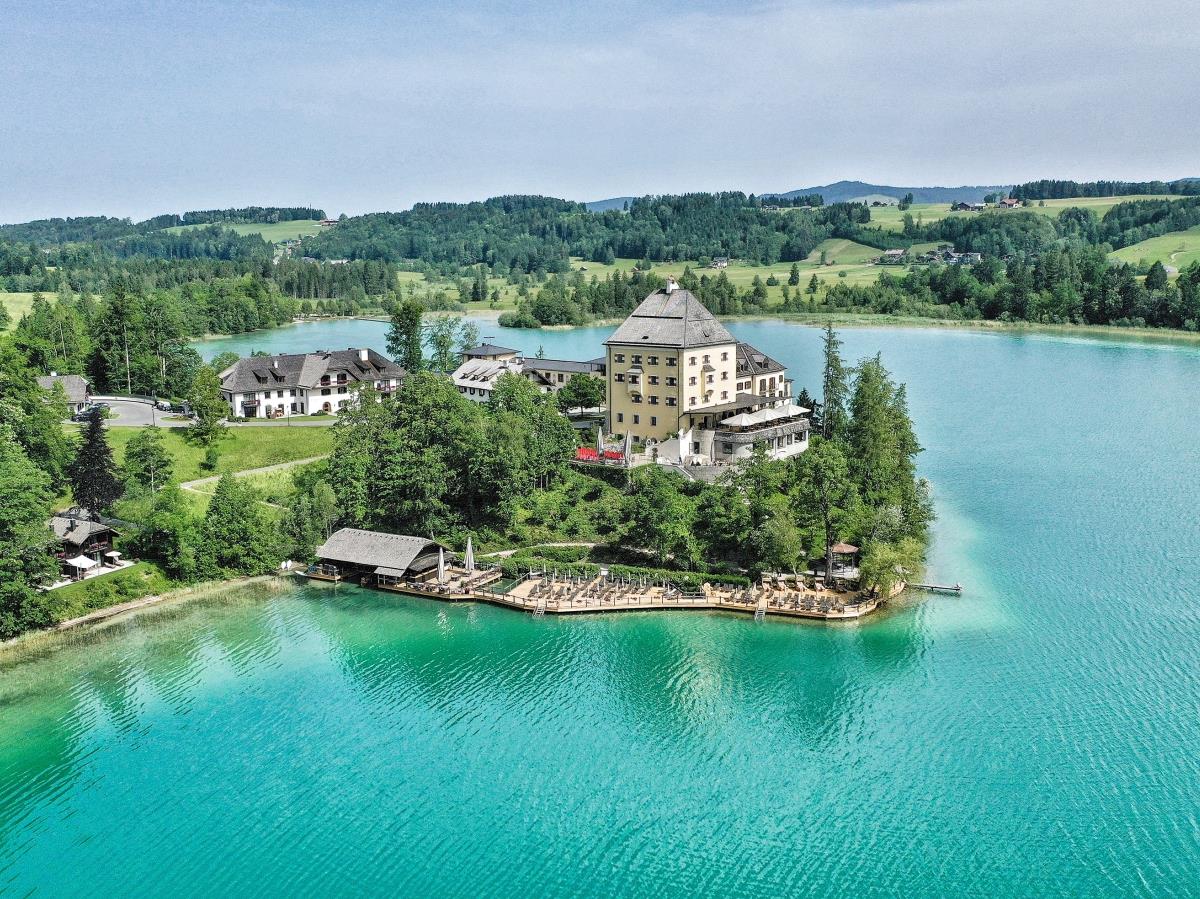 Aerial view of luxury hotel Schluss Fuschl in Austria and the lake