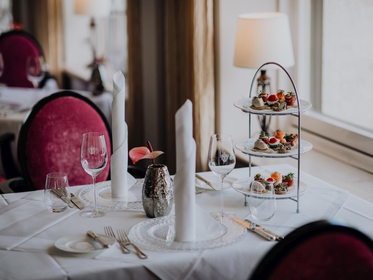 Dining at the restaurant of luxury hotel Schluss Fuschl in Austria