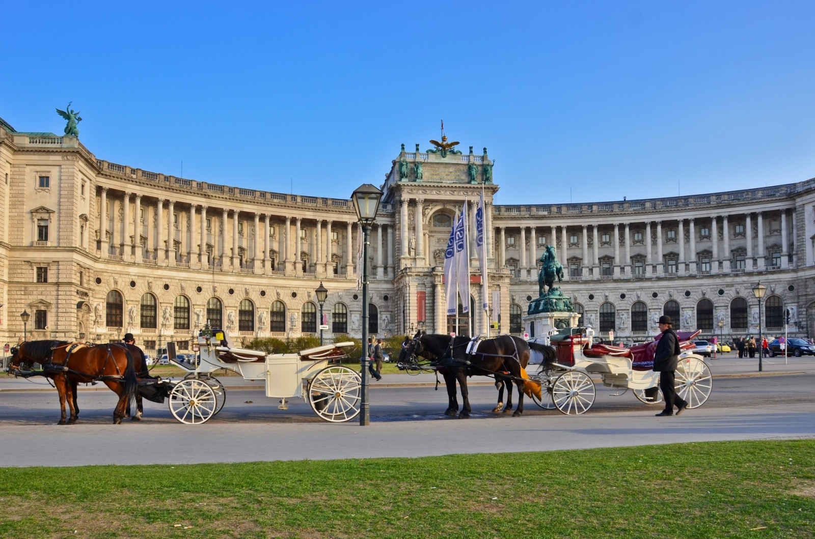 Hofburg palace with horse and carriage in Vienna Austria