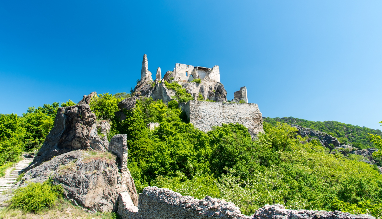View up to an old castle in the Wachu Valley in Austria