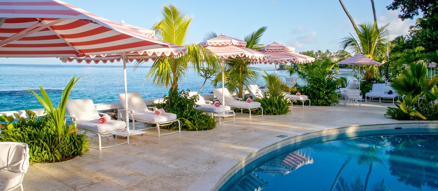 Loungers by the pool at Cobbler's Cove in Barbados