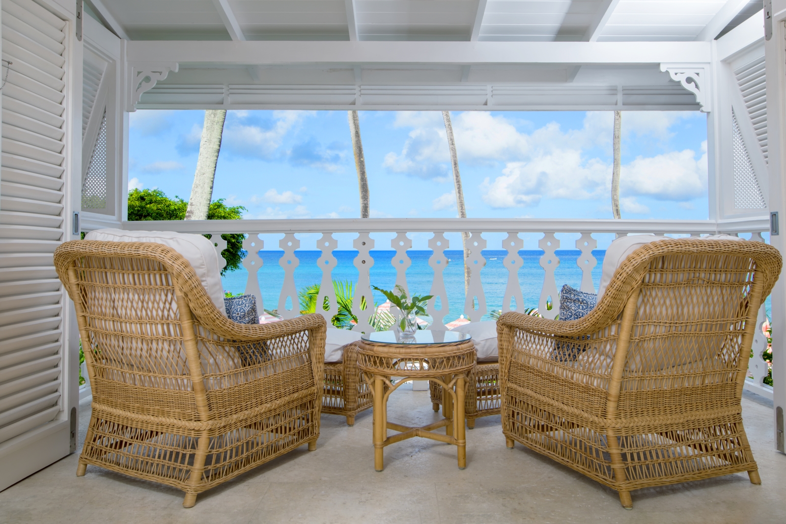 Two chairs overlooking the sea on the terrace of ocean front suite