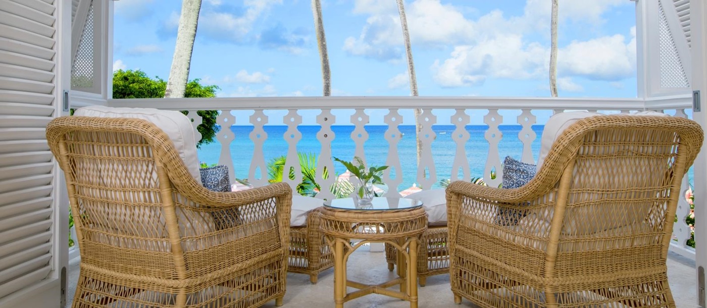 Two chairs overlooking the sea on the terrace of ocean front suite