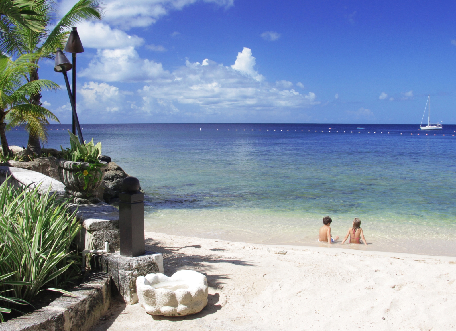 kids on a beach at coral reef club, barbados