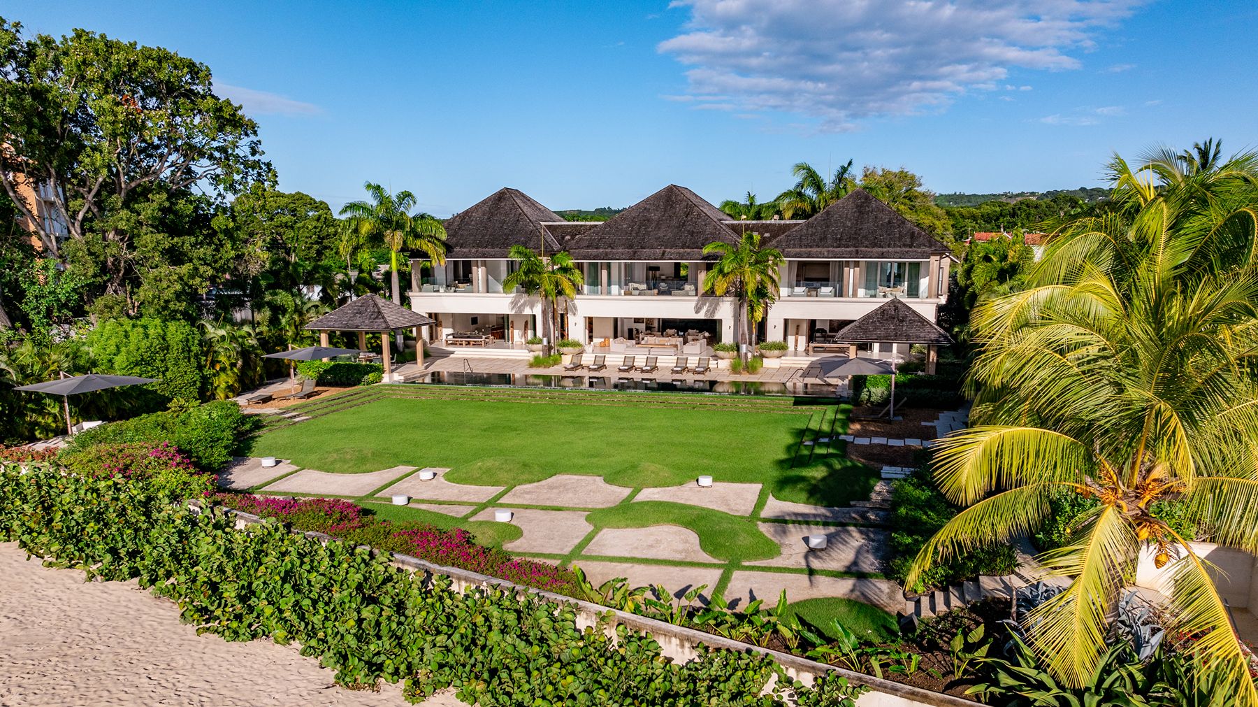 Aerial shot of villa with its garden and the beach at Godings Beach House in Barbados