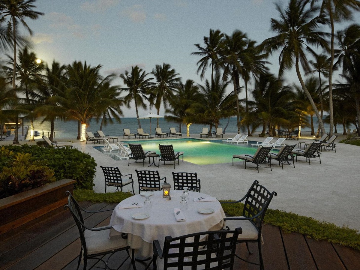 Poolside dining at Victoria House resort on Ambergris Caye Belize